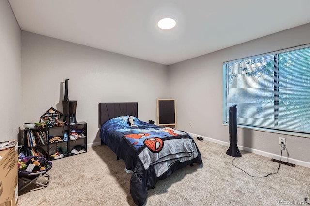 15047 E Louisiana Dr Unit A, Aurora, CO 80012 - carpeted bedroom featuring baseboards