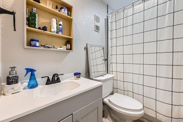 15047 E Louisiana Dr Unit A, Aurora, CO 80012 - bathroom with a textured wall, vanity, and a shower with curtain