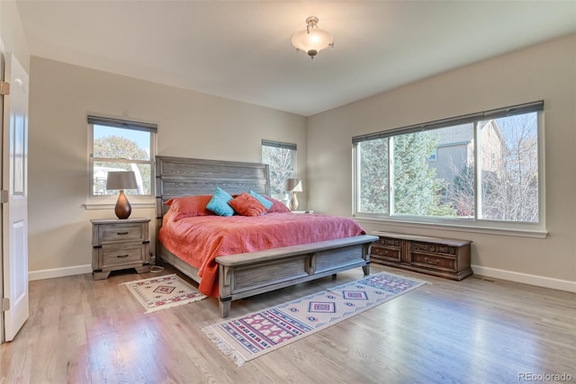 bedroom with light wood-type flooring