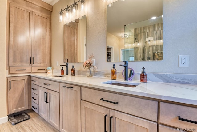 bathroom with hardwood / wood-style flooring and vanity