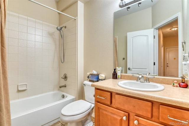 full bathroom with vanity, shower / bath combo, and toilet