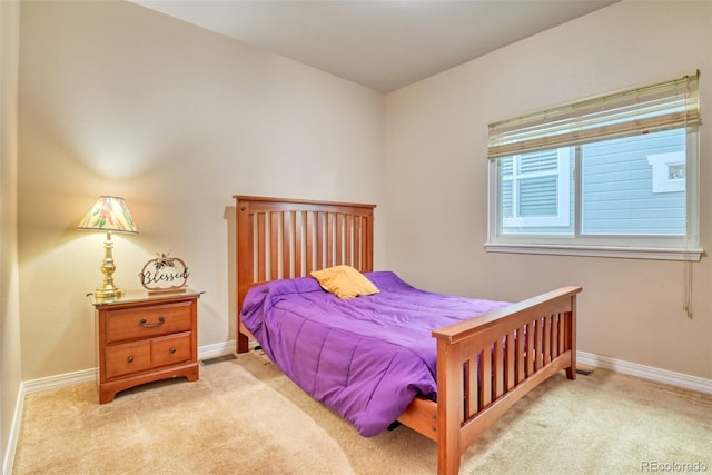 bedroom with light carpet