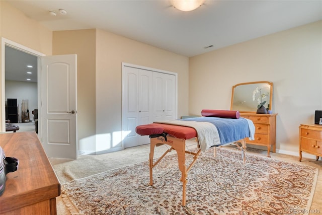 carpeted bedroom featuring a closet