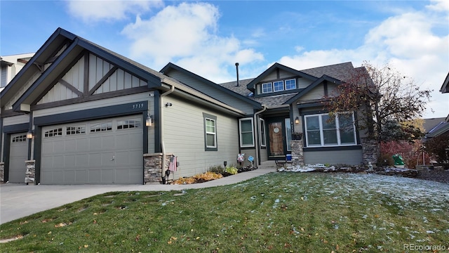 craftsman-style house with a front yard and a garage