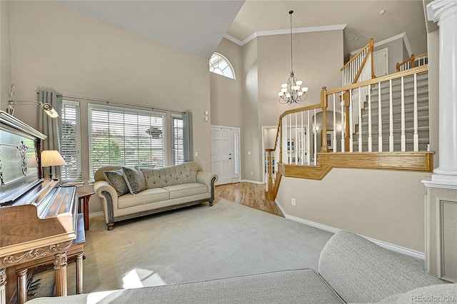 14878 E Aberdeen Ave, Centennial, CO 80016 - living room with stairs, baseboards, a towering ceiling, carpet flooring, and a chandelier