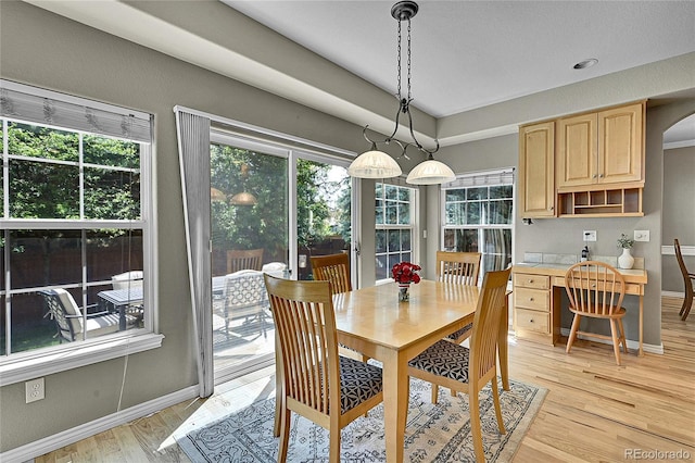 14878 E Aberdeen Ave, Centennial, CO 80016 - dining space with healthy amount of natural light, light wood-style flooring, and baseboards