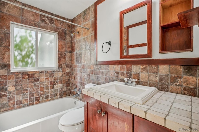 4624 S Lincoln St, Englewood, CO 80113 - bathroom with toilet, shower / tub combination, vanity, and tile walls