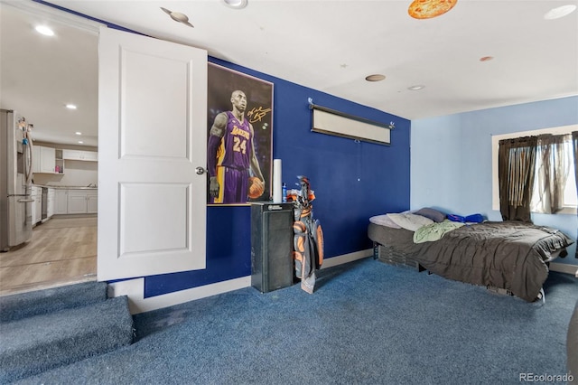 bedroom with carpet floors and stainless steel fridge with ice dispenser