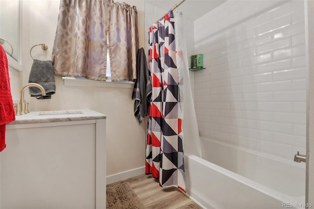 bathroom with vanity, hardwood / wood-style flooring, and shower / bath combo