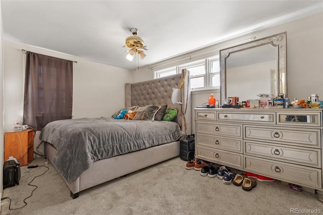 bedroom with light colored carpet and ceiling fan