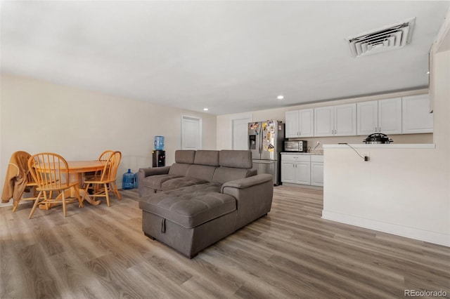 living room featuring light hardwood / wood-style floors