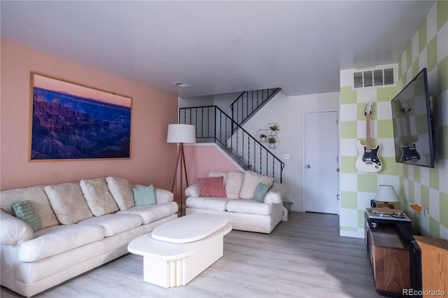 2557 S Dover St Unit 85, Lakewood, CO 80227 - living room with wood finished floors, stairway, and baseboards