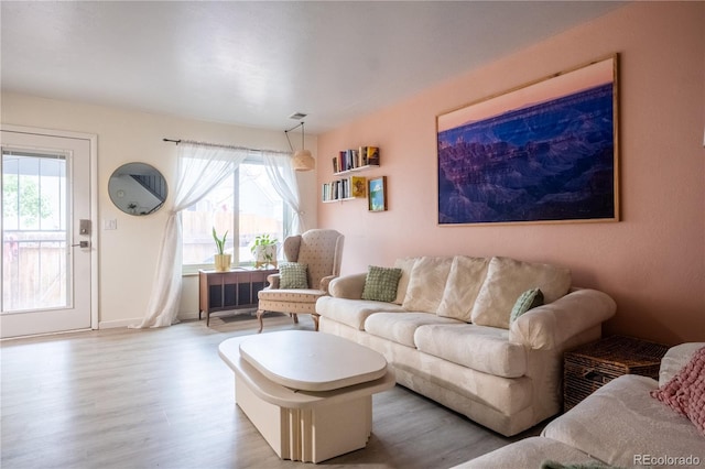 2557 S Dover St Unit 85, Lakewood, CO 80227 - living area featuring wood finished floors and healthy amount of natural light