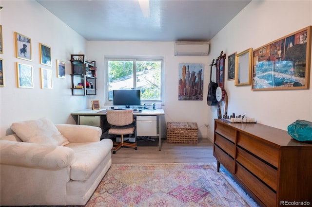 2557 S Dover St Unit 85, Lakewood, CO 80227 - home office with a wall unit AC and light wood-type flooring