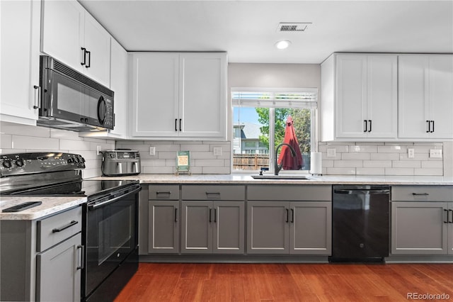 15353 E 98th Pl, Commerce City, CO 80022 - kitchen featuring black appliances, gray cabinets, decorative backsplash, and recessed lighting