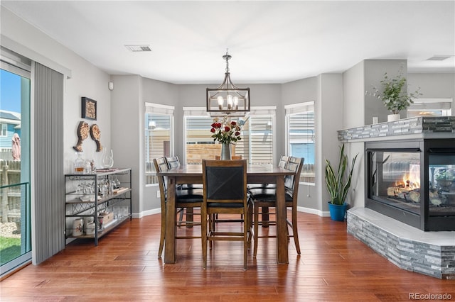 15353 E 98th Pl, Commerce City, CO 80022 - dining area with a chandelier and wood finished floors