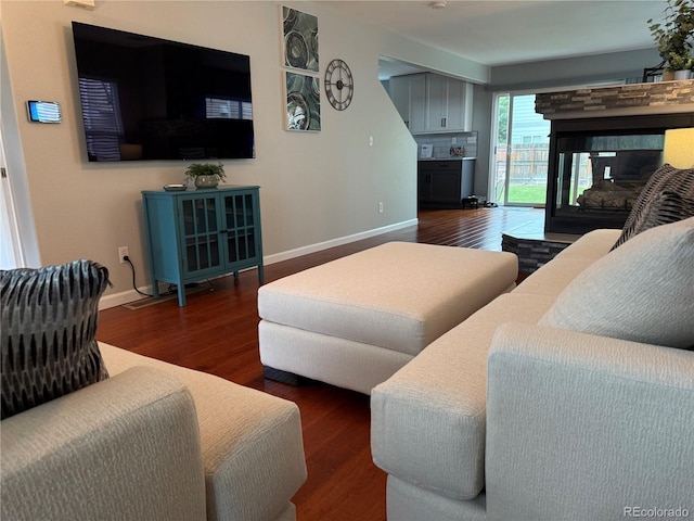 15353 E 98th Pl, Commerce City, CO 80022 - living room with wood finished floors and a fireplace