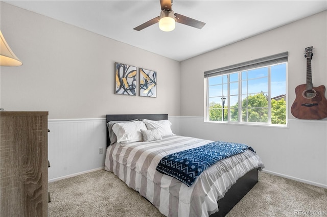 15353 E 98th Pl, Commerce City, CO 80022 - bedroom with carpet, ceiling fan, and a wainscoted wall