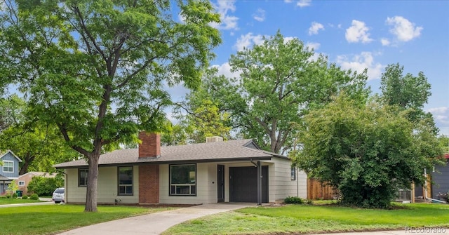1420 S Leyden St, Denver, CO 80224 - single story home featuring an attached garage, a chimney, and concrete driveway