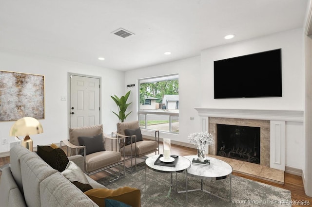 1420 S Leyden St, Denver, CO 80224 - living area with wood finished floors, recessed lighting, a premium fireplace, and baseboards