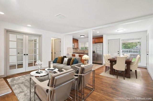 1420 S Leyden St, Denver, CO 80224 - living area featuring french doors, wood finished floors, recessed lighting, and baseboards