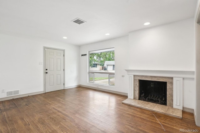 1420 S Leyden St, Denver, CO 80224 - unfurnished living room with wood finished floors, a high end fireplace, recessed lighting, and baseboards
