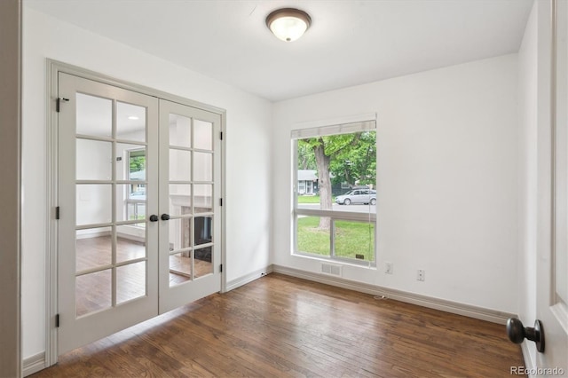 1420 S Leyden St, Denver, CO 80224 - spare room with french doors, wood finished floors, and baseboards