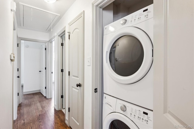1420 S Leyden St, Denver, CO 80224 - washroom with stacked washer and clothes dryer, attic access, and wood finished floors