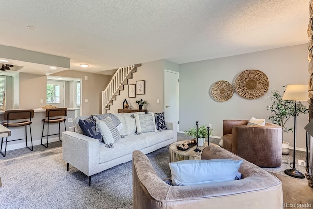 carpeted living room with a textured ceiling