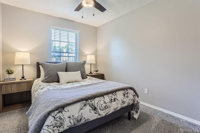 carpeted bedroom featuring a textured ceiling and ceiling fan