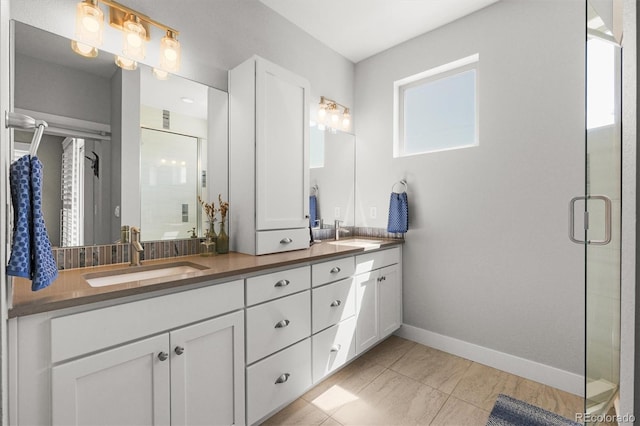 4535 W 50th Ave, Denver, CO 80212 - bathroom with baseboards, a stall shower, and double vanity