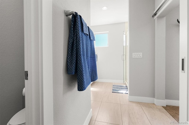 4535 W 50th Ave, Denver, CO 80212 - full bath with a shower stall, baseboards, tile patterned flooring, and toilet