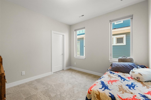 4535 W 50th Ave, Denver, CO 80212 - carpeted bedroom with baseboards and multiple windows