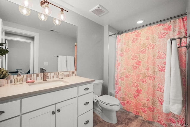 4535 W 50th Ave, Denver, CO 80212 - bathroom with toilet, vanity, tile patterned flooring, recessed lighting, and shower / bath combo