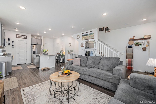 20000 E 40th Ave Unit 4, Denver, CO 80249 - living room featuring recessed lighting, dark wood-style floors, stairs, and baseboards