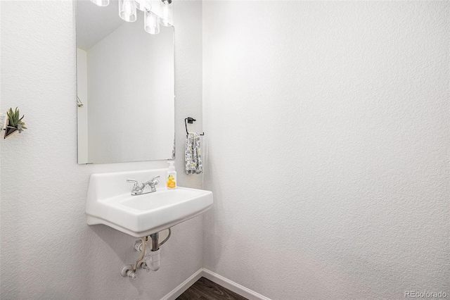 20000 E 40th Ave Unit 4, Denver, CO 80249 - bathroom featuring wood finished floors and baseboards