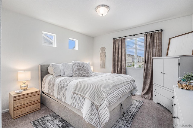 20000 E 40th Ave Unit 4, Denver, CO 80249 - bedroom featuring light colored carpet, multiple windows, and baseboards