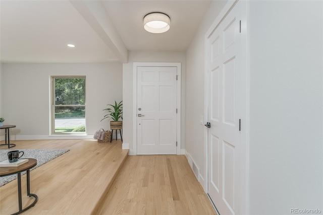 doorway to outside with wood-type flooring