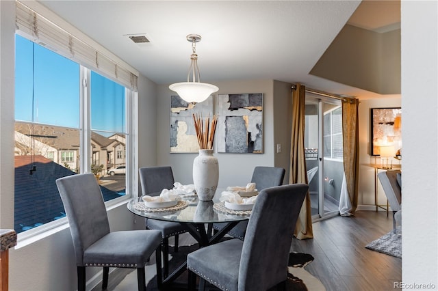 dining space featuring dark hardwood / wood-style flooring