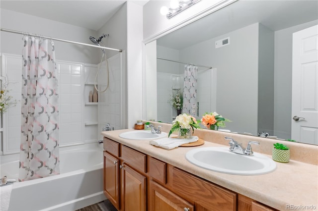 bathroom featuring vanity and shower / tub combo