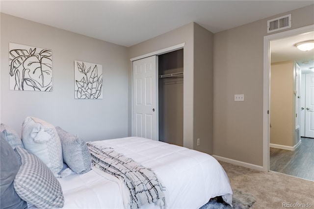 carpeted bedroom featuring a closet