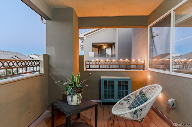 view of balcony at dusk