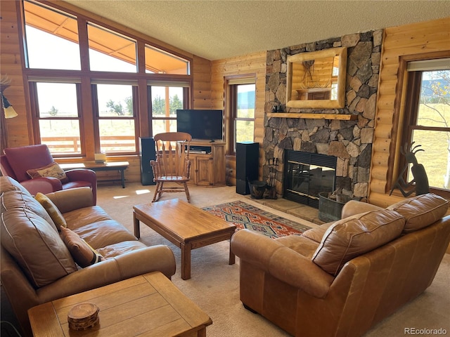 living room with wood walls, lofted ceiling, a textured ceiling, light carpet, and a fireplace