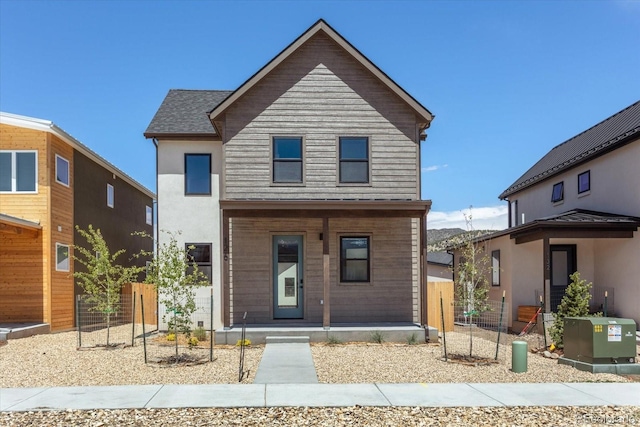 126 Chase St, Salida, CO 81201 - view of front of house with a porch, stucco siding, and fence