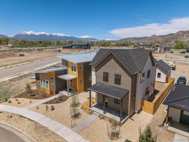 126 Chase St, Salida, CO 81201 - contemporary house with a standing seam roof, a mountain view, metal roof, and covered porch