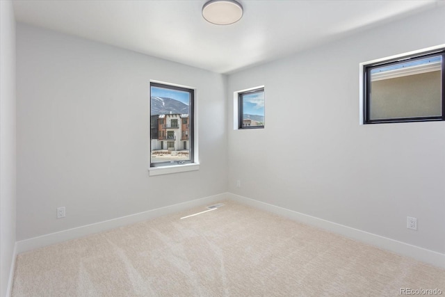 126 Chase St, Salida, CO 81201 - carpeted spare room with plenty of natural light and baseboards