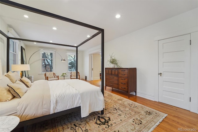 bedroom with light wood-type flooring