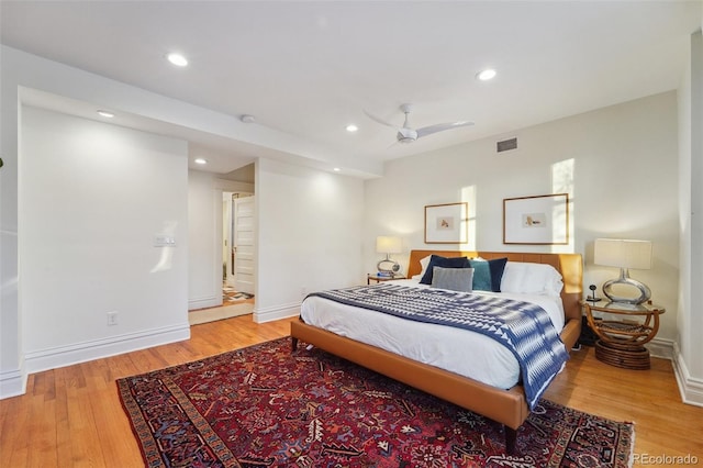 bedroom with hardwood / wood-style floors and ceiling fan