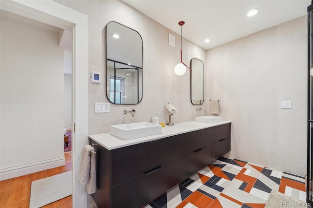 bathroom with hardwood / wood-style floors and vanity