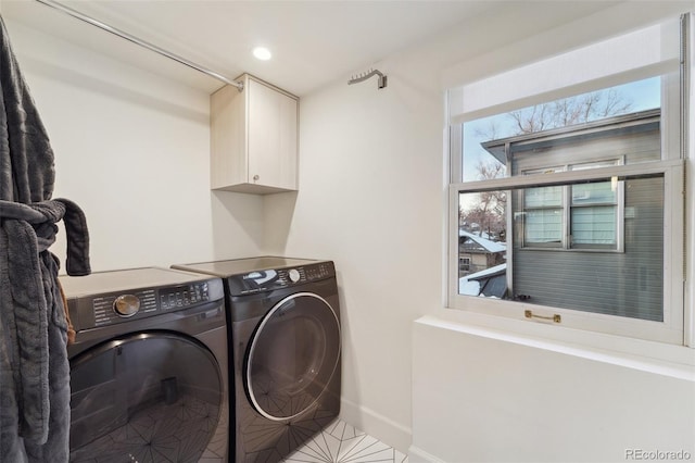 laundry area with cabinets and washer and dryer